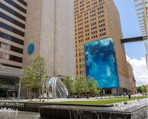 A large blue painting on the side of a building.